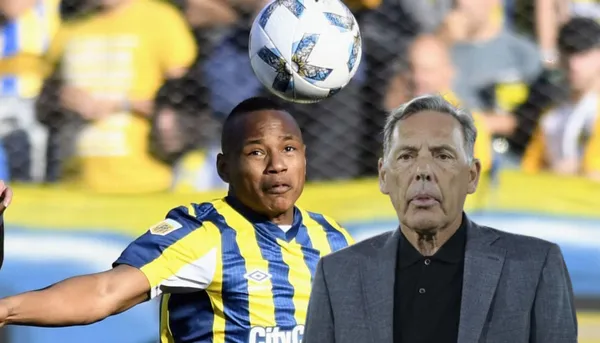 Miguel Ángel Russo, al lado Jaminton Campaz.