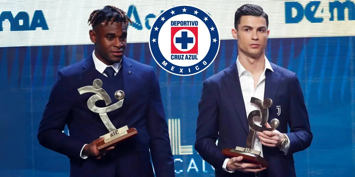 Duván Zapata junto a Cristiano Ronaldo recibiendo un premio en Europa