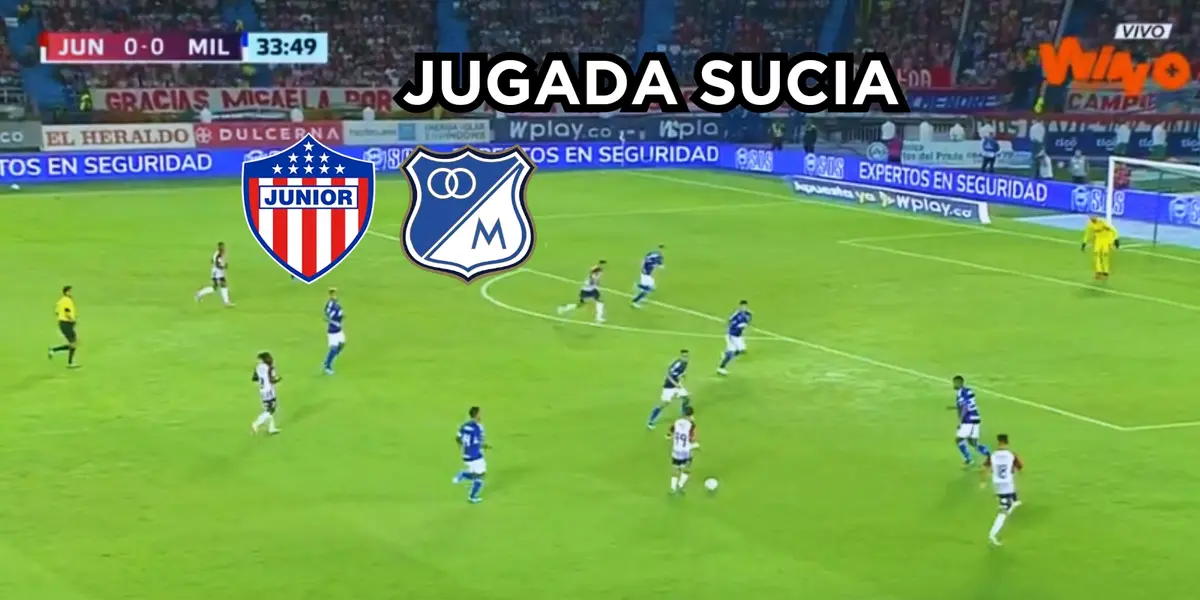 Un jugador del Junior FC en arriesgada jugada contra un futbolista de Millonarios FC.